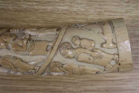 A Belgian Congo ivory oliphant, c.1900, carved with a procession of figures, hammerhead shark fishermen and 41cm